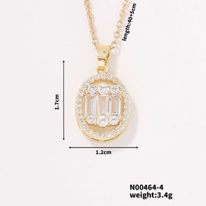 Detailed view of gold oval pendant with white zircons and product dimensions on white background