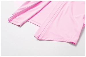 Makroaufnahme der rosa Sportjacke mit robustem Reißverschluss und Saumnaht-Details