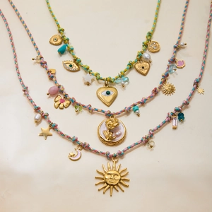 Layered stainless steel necklace with gold heart charms and colorful braided cords