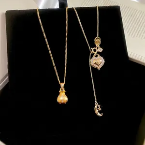 New Chinese style gold necklaces featuring lucky bag and heart pendants with zircon accents