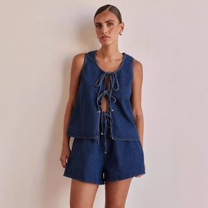 Chic two-piece dark blue denim set with tie-front sleeveless vest and high-waist shorts