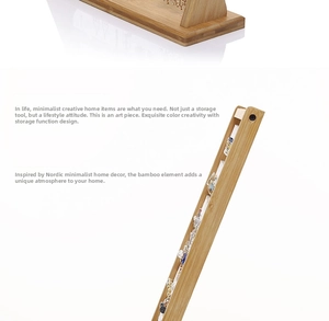 Detailed view of natural bamboo earring display stand with multi-slot organizer base