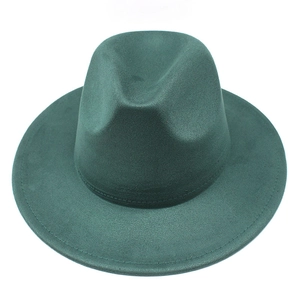 Detail of dark green fedora hat featuring reinforced brim stitching and suede felt texture