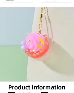 Detailed view of mini dessert sundae charm with pink cream and golden bead chain