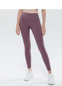 Detail view of high-waisted peach lift yoga leggings in soft mauve with smooth brushed fabric