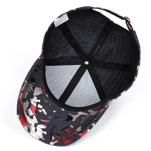 Detail view of the camouflage baseball cap interior with stitching and 100% polyester label