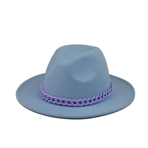 Detail of light blue wool felt fedora hat featuring a purple chain link band decoration