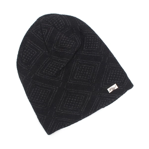 Detail of black knit beanie featuring geometric diamond pattern and Heat brand label
