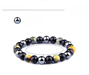 Detail of 8mm tiger eye and hematite beaded bracelet with adjustable 6.6-8.2 inch cord