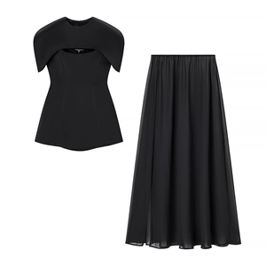Fashionable black two-piece set featuring structured hollow top and flowy maxi skirt