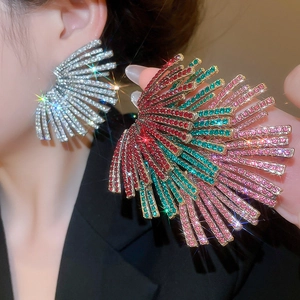 Close-up of statement geometric fan earrings with sparkling rhinestones on model