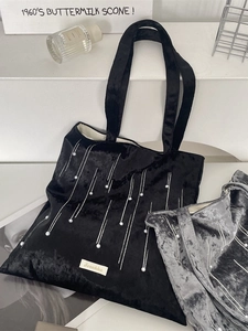 Fashionable velvet tote bag with pearl accents and vertical stitching in black and gray