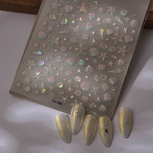 Detail von 5D-Ozean-Nagelstickern mit Seesternen, Muscheln und Aurora-Laser-Effekt