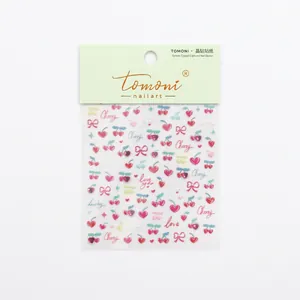 Sparkling cherry nail art stickers with 3D crystals and heart patterns on white background