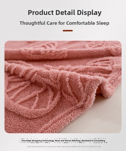 Detailed view of pink flannel blanket featuring neat stitching and soft velvet texture