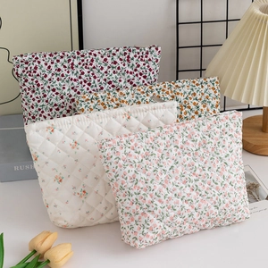 Quilted floral makeup bags in four colorful patterns with high-quality zipper closure
