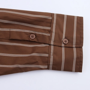 Detailed close-up of brown striped shirt cuffs with premium resin buttons and neat stitching