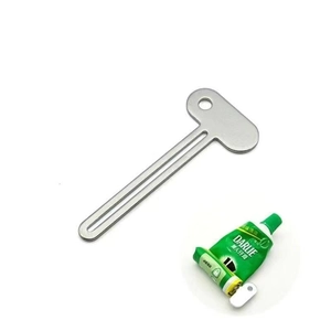 Manual metal tube squeezer showing how to extract toothpaste from a green tube efficiently