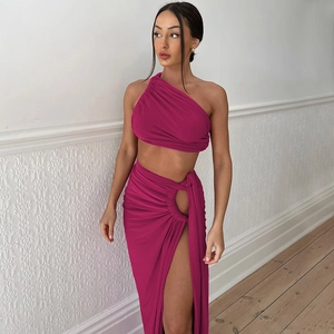 Detail of magenta backless crop top and high slit skirt set with ruched drape texture