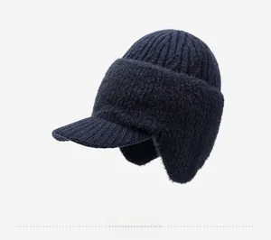 Detail of dark blue knit winter hat for elderly men with ear flaps and side button