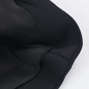 Detail of the black halter vest showing premium striped fabric texture and stitching