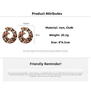 Detail view of large leopard print fabric drop earrings with dimensions and 20.2g weight