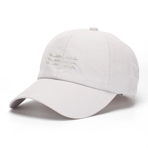 Close-up of light gray baseball cap featuring premium tonal embroidered lettering detail