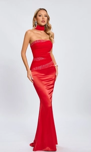 Detail of red off-shoulder rhinestone evening gown with pleated waist and sequin accents