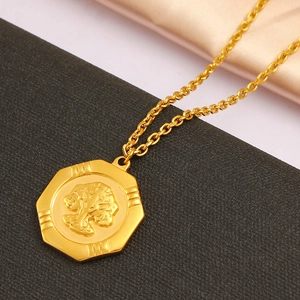 18K gold plated stainless steel necklace with octagonal tree pendant on silk background