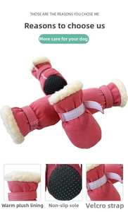 Detail view of warm plush lining and non-slip rubber dots on pink dog snow boots