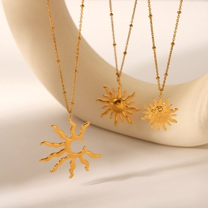 Three gold stainless steel sun pendant necklaces featuring hollow and solid face designs