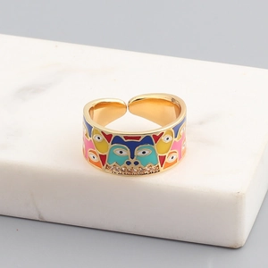 Macro shot of gold enamel husky dog ring featuring colorful drip oil and white zircon
