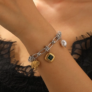 Fashion stainless steel link bracelet with gold heart, green gemstone, and pearl charms