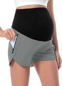 Dettaglio dei pantaloncini sportivi premaman con tasca con zip e tessuto traspirante