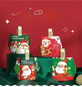 Set of four Christmas gift boxes featuring Santa Claus patterns with golden handles