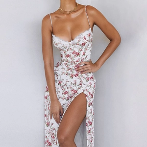 Detail view of floral slit dress with lace trim and elegant red rose pattern