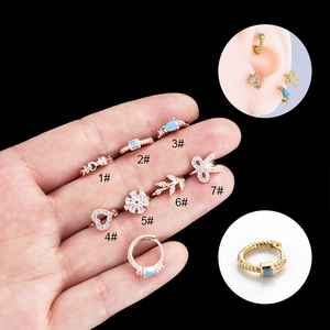 Set of gold-plated hoop earrings with bow and heart zircon motifs for cartilage piercings