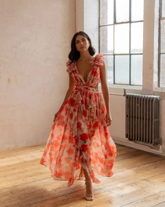 Detail of red floral chiffon maxi dress with deep V-neck, ruffles, and waist ring detail