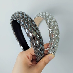 Detailed view of wide headbands with sparkling rhinestones in dark grey and silver white