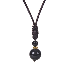 Handmade woven necklace featuring natural tiger eye stone beads and polished obsidian pendant