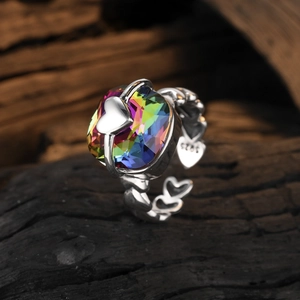 Silver S925 heart ring featuring a large rectangular rainbow crystal on dark wood