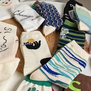 Various Korean style cotton mid-calf socks with stripes and cute cat embroidery patterns