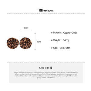 Detail of 8cm leopard print fabric rose earrings with dimensions and material specs