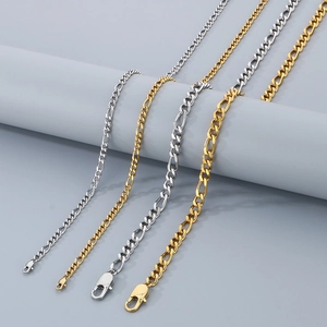 Detail of 4mm and 6mm gold and silver Figaro chain necklaces with lobster clasps