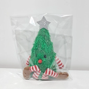 Detail of plush Christmas tree doll with green faux fur and striped knitted arms