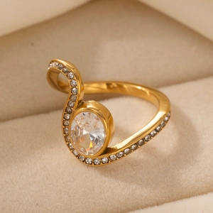 Elegant gold stainless steel S-shape ring with oval zircon and natural stone in a box
