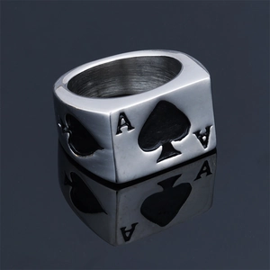 Macro shot of punk style stainless steel ring with Ace of Spades poker card design