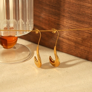 Minimalist 18k gold plated stainless steel teardrop hook earrings on display