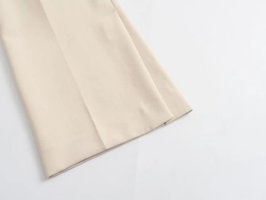 Detailed macro view of the cream white high-density fabric texture and smooth hem finish