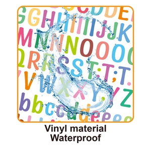 Close-up of waterproof vinyl alphabet stickers showing water droplets on the surface